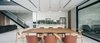 Modern home with Dining Room, Table Lighting, Ceiling Lighting, Chair, Stools, Bar, Table, Ceramic Tile Floor, Pendant Lighting, and Bench. dining area Photo 5 of bAAn