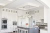Kitchen ceiling enhancement. Clean white vibe to the island area. Photo of Minnesota Home modern home