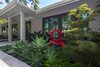 Modern home with Outdoor, Garden, Front Yard, Hardscapes, Trees, Shrubs, Gardens, Concrete Patio, Porch, Deck, Raised Planters, and Small Patio, Porch, Deck. An outdoor extension of the living room. The planting more a visual point of the living room and the sculpture is by Rob Lorenson. Photo 3 of Modernist Retreat