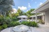 Modern home with Outdoor, Back Yard, Side Yard, Garden, Shrubs, Gardens, Large Pools, Tubs, Shower, Walkways, Trees, Hardscapes, Swimming Pools, Tubs, Shower, Lap Pools, Tubs, Shower, Large Patio, Porch, Deck, Tile Patio, Porch, Deck, Standard Construction Pools, Tubs, Shower, and Small Patio, Porch, Deck. A private patio off the Master Suite was designed to allow the owners their own space away from guest and the main pool area. Photo 10 of Modernist Retreat