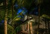 Modern home with Outdoor, Back Yard, Shrubs, Trees, Garden, Gardens, Hardscapes, Walkways, Pavers Patio, Porch, Deck, Small Patio, Porch, Deck, and Landscape Lighting. Landscape lighting helps to create drama Photo 18 of Key West Classic