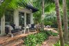 Modern home with Outdoor, Back Yard, Hardscapes, Garden, Trees, Gardens, Walkways, Pavers Patio, Porch, Deck, Large Patio, Porch, Deck, and Landscape Lighting. The main bedroom opens up to the garden and allows easy access to & from the pool. Photo 7 of Key West Classic