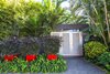 Modern home with Outdoor, Garden, Shrubs, Trees, Front Yard, Hardscapes, Walkways, Gardens, Raised Planters, Landscape Lighting, and Pavers Patio, Porch, Deck. Mass groupings of the same species help create a sense of space with the bold containers create a visual impact and mimic the use of color throughout the garden. Photo 2 of Von Phister