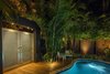 Modern home with Outdoor, Side Yard, Garden, Shrubs, Trees, Walkways, Hardscapes, Small Pools, Tubs, Shower, Gardens, Standard Construction Pools, Tubs, Shower, Wood Patio, Porch, Deck, Plunge Pools, Tubs, Shower, Decking Patio, Porch, Deck, Landscape Lighting, and Metal Fences, Wall. Lighting is a huge part of the design. The main consideration is to focus on features that you want to accentuate while letting the less important features fade into the darkness. Well designed lighting can give a feature wall even more sculptural qualities when properly lit. Photo 18 of Von Phister