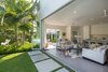 Modern home with Outdoor, Back Yard, Trees, Side Yard, Shrubs, Grass, Garden, Hardscapes, Small Patio, Porch, Deck, Landscape Lighting, Walkways, and Concrete Patio, Porch, Deck. Indoor/outdoor living in 'key' here in the Florida Keys. Photo 10 of Tropical Minimal