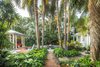 Modern home with Outdoor, Side Yard, Back Yard, Garden, Hardscapes, Trees, Gardens, Walkways, Shrubs, Small Pools, Tubs, Shower, Swimming Pools, Tubs, Shower, Small Patio, Porch, Deck, Landscape Lighting, Standard Construction Pools, Tubs, Shower, and Pavers Patio, Porch, Deck. Lush tropical planting with plenty of privacy planting to remind the owner Fred of the gardens of his youth. Photo 2 of Fred's Garden