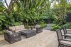 Modern home with Outdoor, Hardscapes, Gardens, Walkways, Garden, Shrubs, Back Yard, Large Patio, Porch, Deck, Trees, Landscape Lighting, and Pavers Patio, Porch, Deck. Indoor/outdoor living isn not complete without an outdoor seating area. Photo 15 of Key West Modern