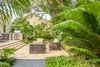 Modern home with Outdoor, Garden, Trees, Back Yard, Shrubs, Hardscapes, Walkways, Pavers Patio, Porch, Deck, Gardens, Large Patio, Porch, Deck, and Landscape Lighting. An outdoor kitchen was added with concrete countertops that could resist the harsh summer heat and easy for clean-up. Photo 17 of Key West Modern