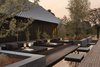Modern home with Outdoor, Wood Patio, Porch, Deck, Walkways, Hardscapes, Landscape Lighting, Trees, Shrubs, Side Yard, and Back Yard. The resort has 24 suites, each 1,065 square feet, and four two-bedroom villas, at 3,710 square feet. Other on-site amenities include a full spa, rock garden, workout center, yoga studio, library, bar, and restaurant. Photo 10 of Amanemu