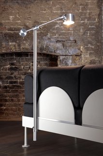 The detachable BOOM light takes its inspiration from machinist lamps and back panels made of polished and anodised aluminum provide back support.