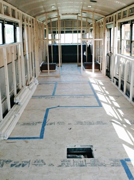 The layout is taped on the floor and the wall framework is in.