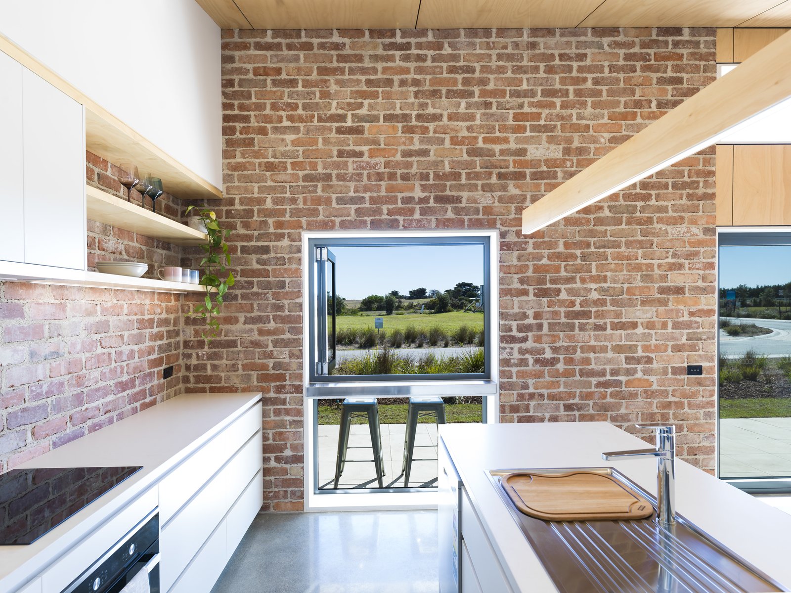 A pass-through window in the kitchen connects to the porch for ease of socializing.