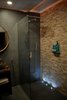 Modern home with Bath Room, Stone Tile Wall, Recessed Lighting, Vessel Sink, Full Shower, Ceramic Tile Floor, Wood Counter, and Accent Lighting. The Lodge includes a spa bathroom with rain shower head. Photo 5 of Panorama Glass Lodge