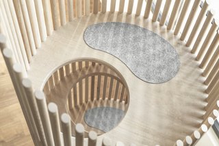 Cats can climb up and down inside the tree and rest on the various platforms. The wool pads are sourced from Kvadrat, a Danish textile company.