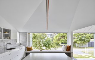 The kitchen window-seat overlooks the backyard garden.

