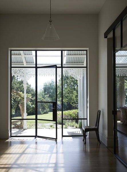 Steel-framed openings create new views into the historic garden.