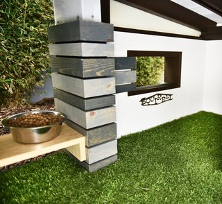 An interior window enables the dog to monitor its surroundings.