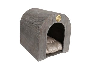Kelly Wearstler offers an unconventional take on the dog house with this arched shape in cerused Douglas fir. That signature Wearstler flair is incorporated via a bed upholstered in Kelly Wearstler Outdoor Fabric and a bronze insignia stamped with the designer’s kiss motif.