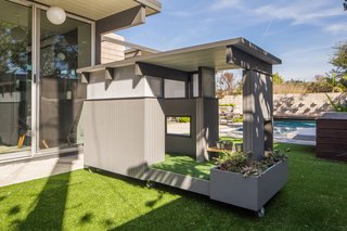 The Beam House is an ode to the classic indoor/outdoor California lifestyle, and it riffs on the architecture of Orange County. Its walls are clad in clean-lined vertical siding and topped with clerestory windows. The flat roof sports pronounced eaves.