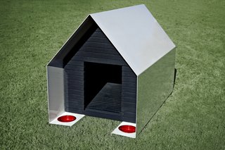 archimania, an award-winning architecture firm based in Memphis, was inspired by a matchbook when they designed the DOGone House for a rescue charity event. An outer skin of one-fourth-inch folded steel wraps an inner box composed of slatted stained wood, which allows air circulation and views.