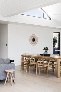 "The folded roof was implemented to allow for clerestory windows to let light deep into the living spaces of the extension from the north, east, and west," say the architects. "The six different shaped clerestory windows were a key strategy to addressing the day lighting issues inherent in a south-facing rear yard."