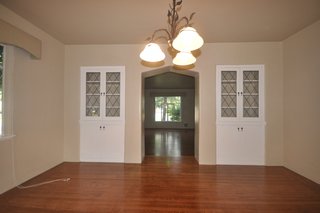 Before: Beige tones and dreary lighting left the living room uninspired.