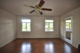 Before: In order to make the room feel larger, the couple raised the ceiling height by 18 inches.