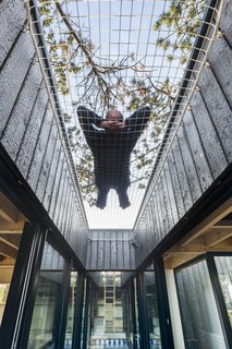 The netting suspended over the water feature makes for a whimsical spot to stargaze.