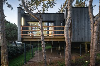 The deck off of the bedroom has two swings attached.