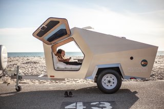 Gull-wing doors flank a three-quarter-size mattress that sleeps two adults.