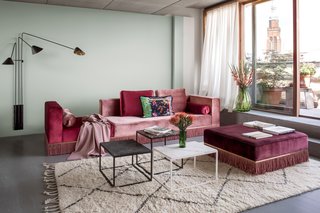 Bruzkus designed the living room sofa, as well as the floating marble tables. 