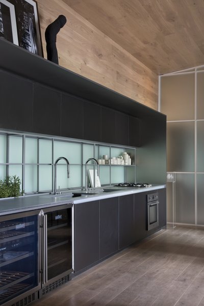 The charcoal kitchen cabinets are from Dell Anno.