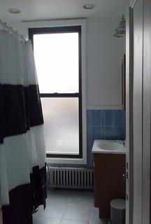 Before: on the second floor, there is now the master suite and a combined guest room/office. This shows the bathroom that would become part of the en-suite.