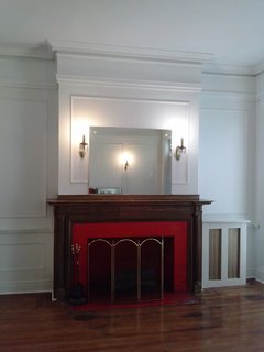 Before: the red tile around the fireplace surround was jarring.