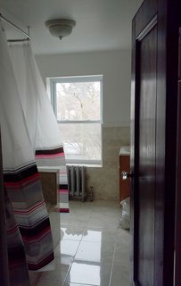 Before: the finishes in the guest bathroom were dated.