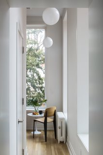 The new configuration removes the staircase in order to separate the floors. This made room for an additional bedroom in the garden apartment below and provided enough space for a powder room and breakfast nook on the parlor level. 