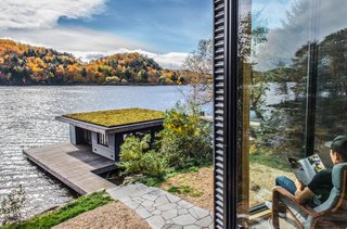 The roof of the carport forms a deck off the second-floor living and dining rooms. The deck also accesses the incredible lake views.