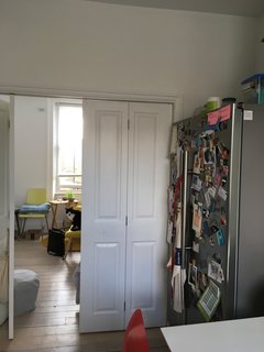 A view of the doorway from the kitchen. The entire kitchen/living room is 280 square feet.