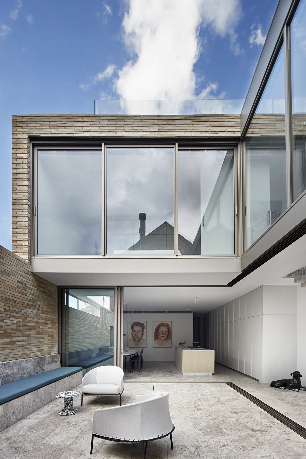 patio living room with large glass doors on Photo 50 Of 208 In Outdoor Stone Large Photos From Before After A Derelict Cottage And Dairy Stable Become A Sleek Family Compound Dwell