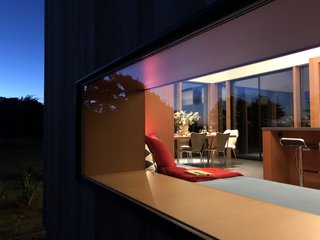 “I think my favorite part of the house is the dining area in the great room,” says Kieron. “It points one’s gaze toward the majestic canopy of the cypress hedgerow abutting the Gualala river; I never tire of that landscape. Also, in the stillness of the early morning, the deer graze around the glass box that is Skyfall, and I feel like roles have reversed and they have come to visit their human zoo.”