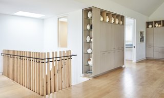 The firm specified a museum reveal around the windows, doors, and cabinetry, as well as over the flush baseboard. This keeps the scheme minimal and creates a “very simple tracery where you have a punctuation in the architecture, and then you reveal back to the soft white drywall walls,” says Klymson.