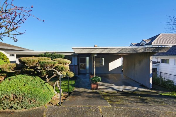 Before: A carport dominated the front facade of this 1951 house.