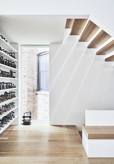 “We tried to open up views to the the side yard as much as possible, while placing windows in areas where you don’t necessarily need to draw your blinds,” says Radutny. This collection of irons belonged to the client’s father, who was an industrial designer.