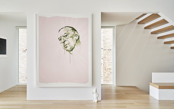 The main floor powder room is behind the wall. 