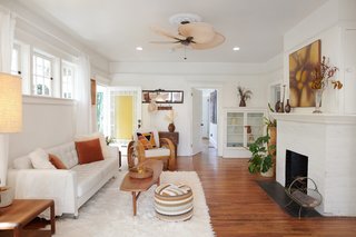 Rossi kept important features of the old home throughout, such as the built-ins, fireplace, and original floors.