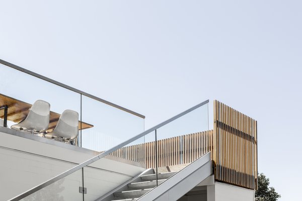 The staircase, with precast concrete steps, now leads down to the future pool terrace. "We sought to connect the spaces so the family could be relaxed and meander barefoot through the property," says Wittman.  