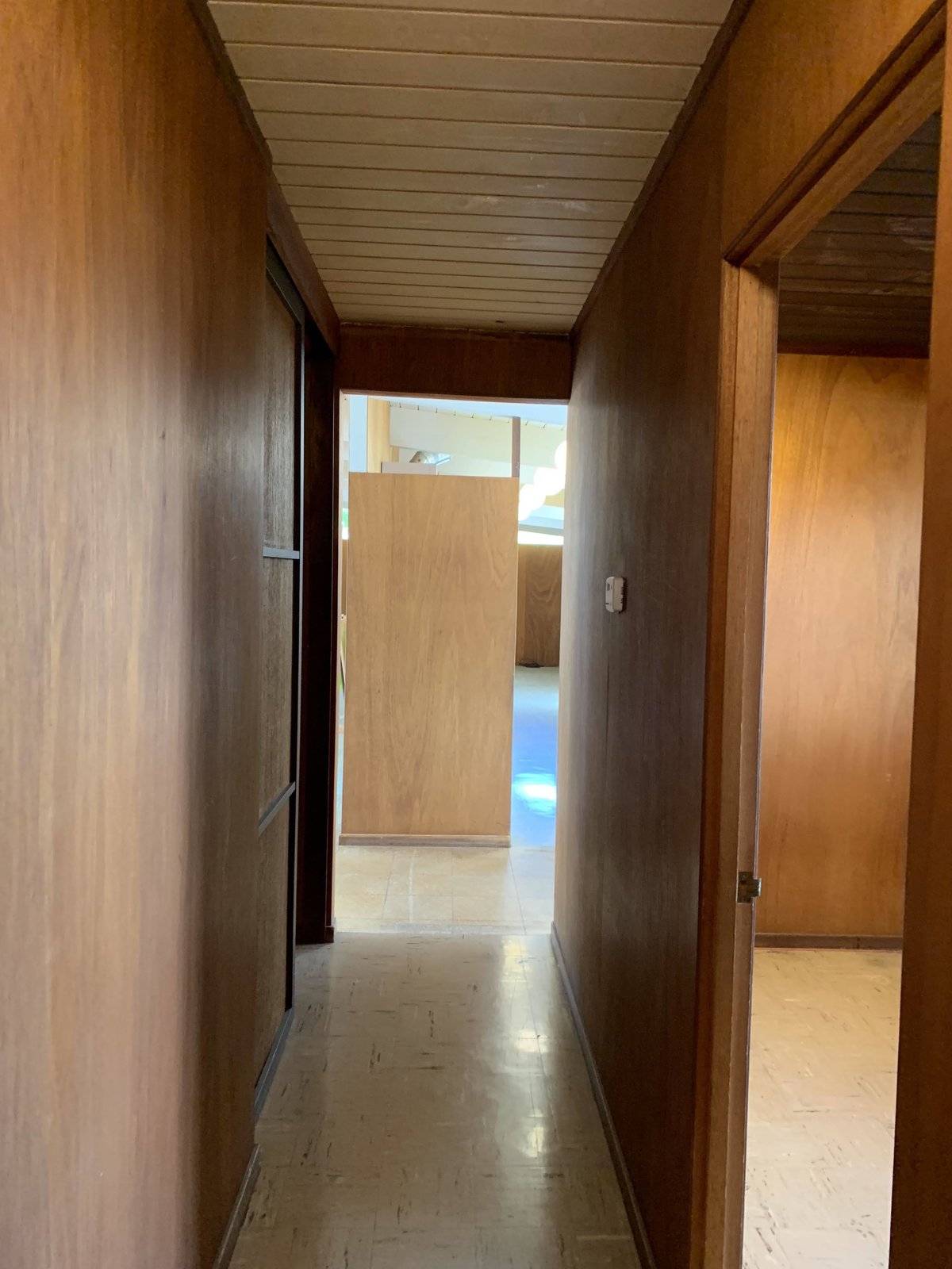 Before: The firm retained the original wood paneling and shoji screen in the hall.