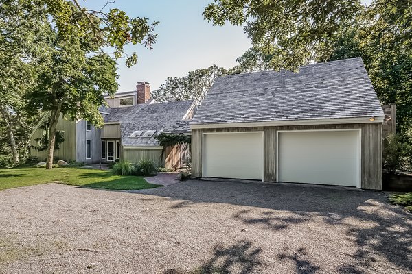 Before: The approach to the home was dominated by the garage. It provided privacy to the house behind, but it was an eyesore.