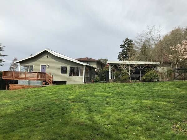 Before: The existing house on this West Seattle lot was pushed to one side, leaving plenty of green space for designers John and Denise Schack to work with.