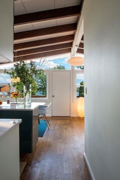 Taking down the floating upper cabinets created better sight lines from the kitchen out the windows.